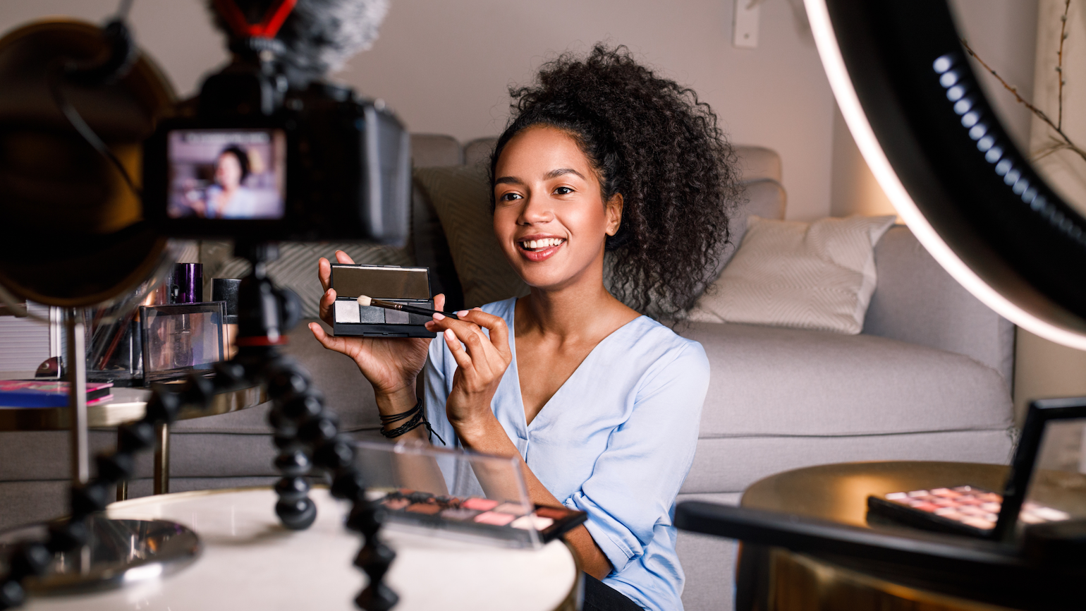 An influencer creating engaging video content to promote beauty products and connect with their audience.