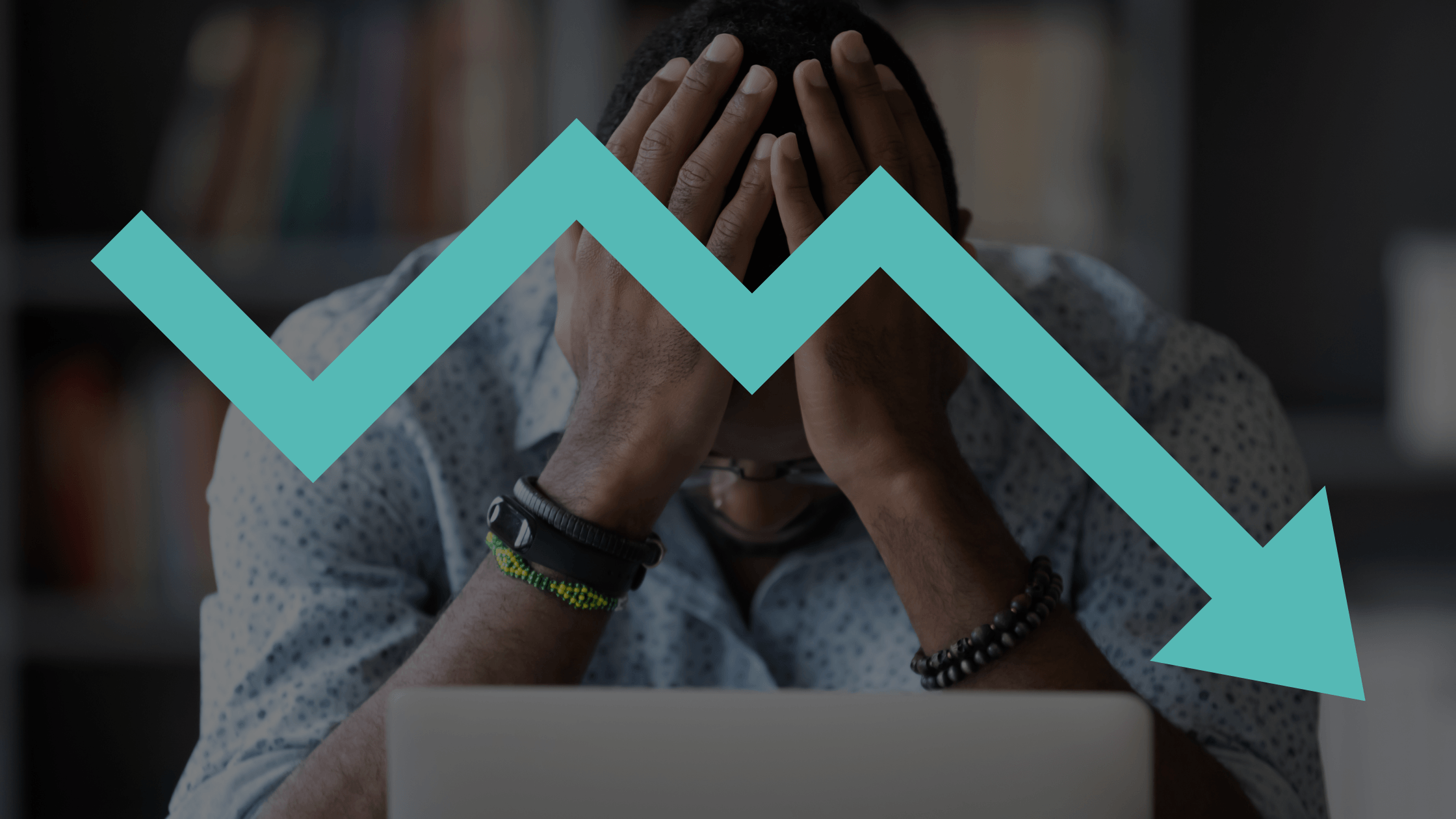 A frustrated business owner with his head in his hands behind a laptop, overlaid with a declining teal arrow graphic, symbolizing the lack of ROI from a poor marketing agency partnership.