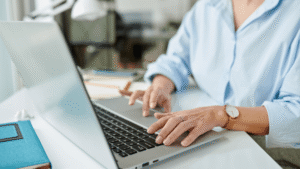 Small business owner reviewing email marketing analytics dashboard showing high ROI performance in 2026